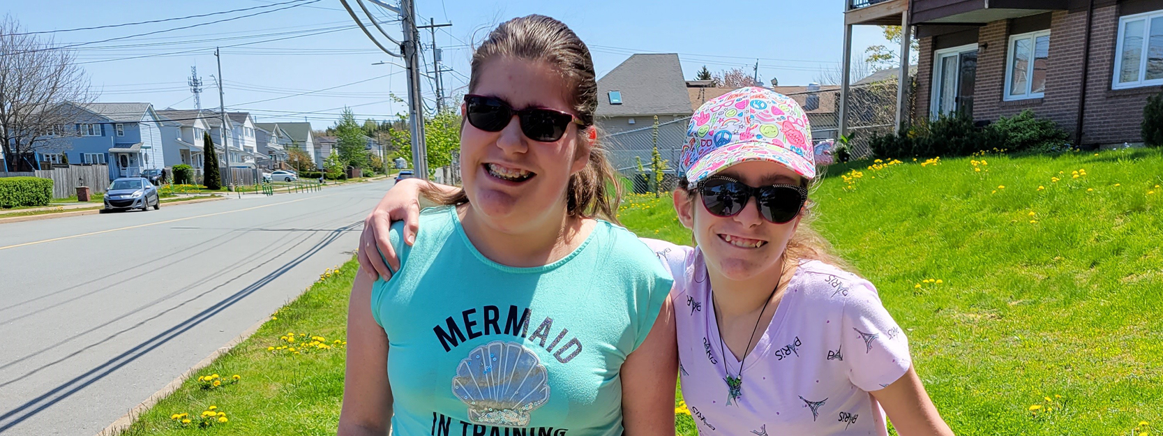 mother and daughter outside in the sunshine