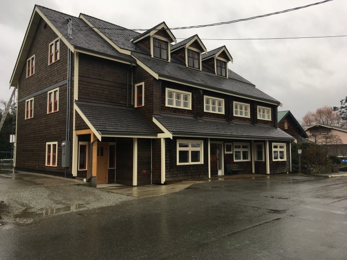 The Salt Spring and Southern Gulf Islands Community Services Society (SSICS) McPhillips Building. It is a large brown building with three peak windows on top.